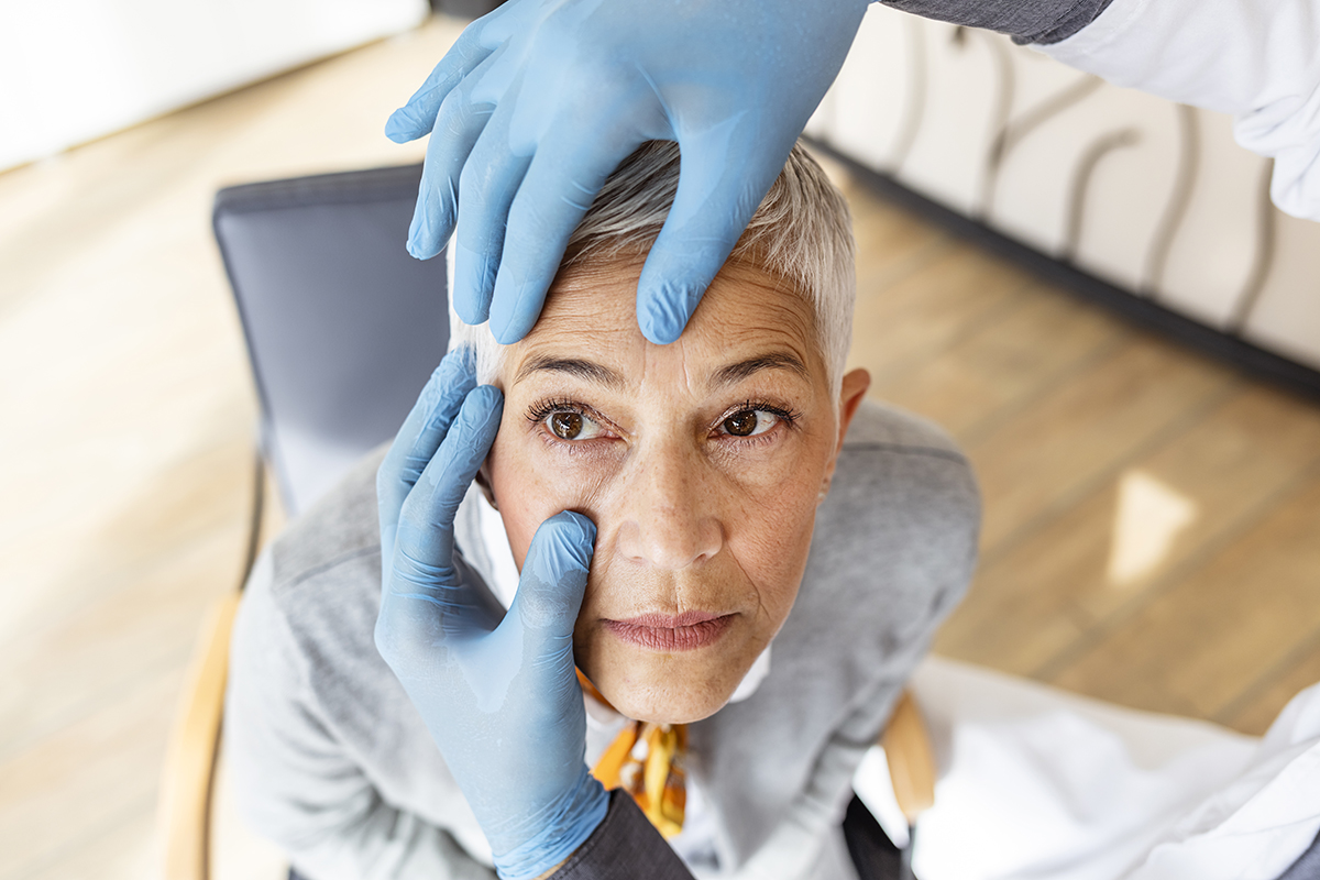 Mature woman getting her eyes checked for cataracts