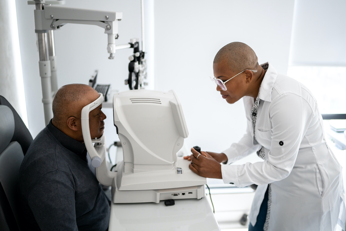 Optometrist and patient during an eye exam