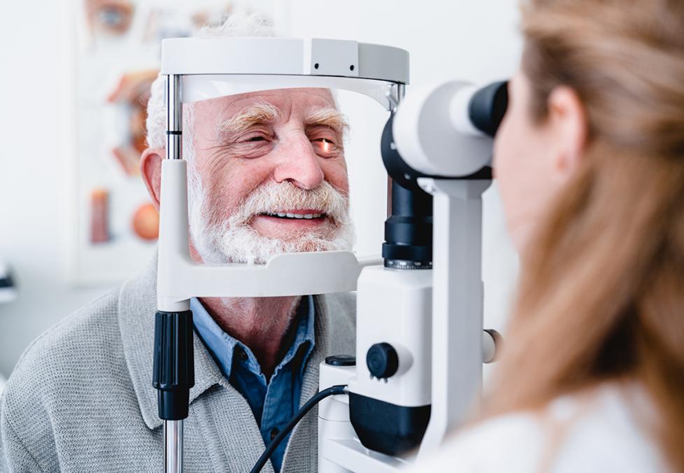 Older man getting his eyes examined at the eye doctor