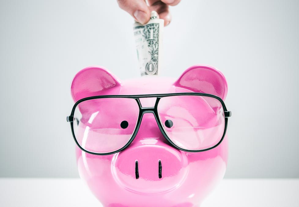 Piggy bank with glasses.