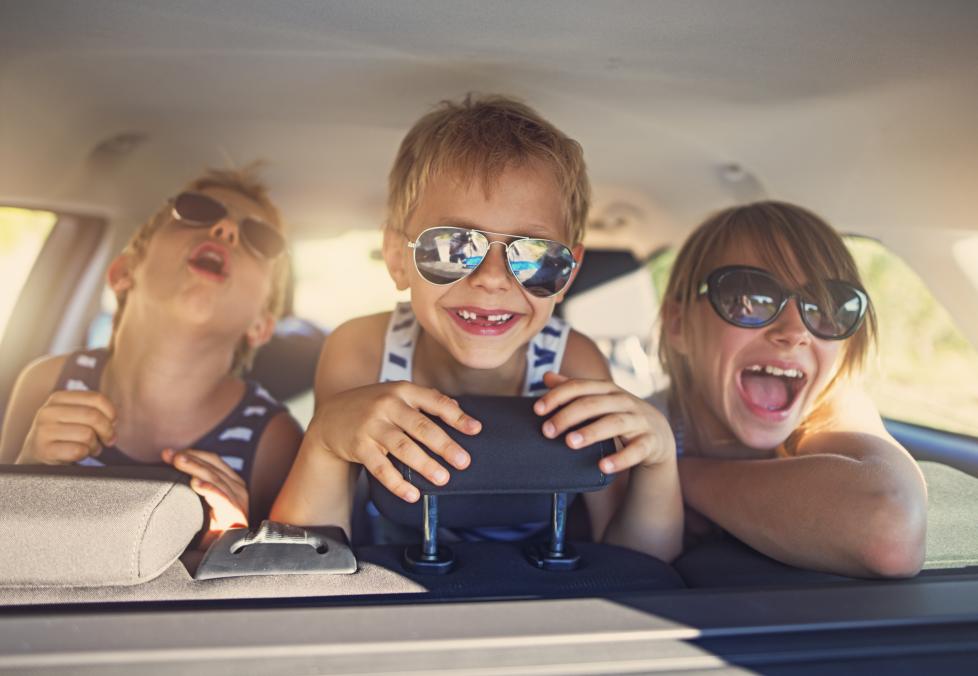 Kids in car wearing sunglasses