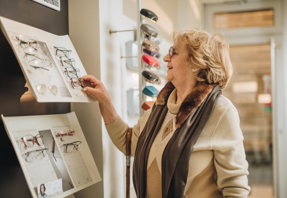 America's Best can help seniors save on much-needed eyecare. Woman shopping for glasses.