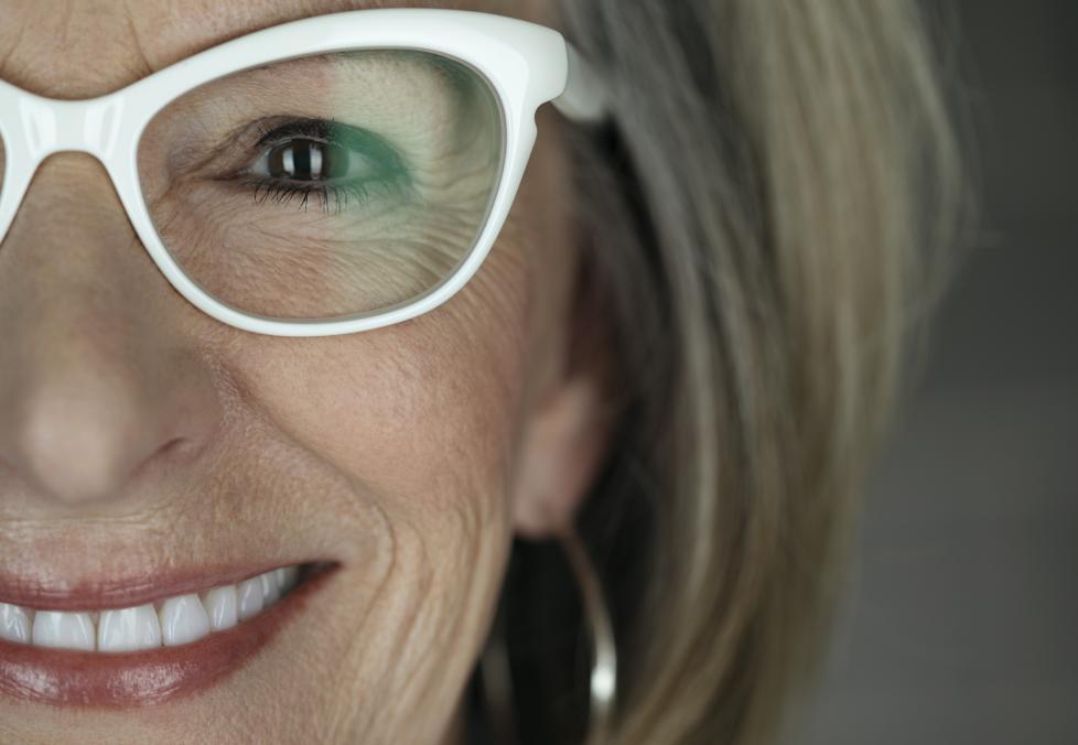 Closeup of smiling woman wearing glasses
