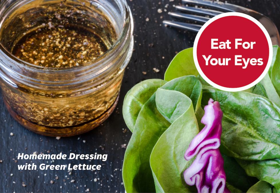 Mason jar of herbed olive oil vinaigrette