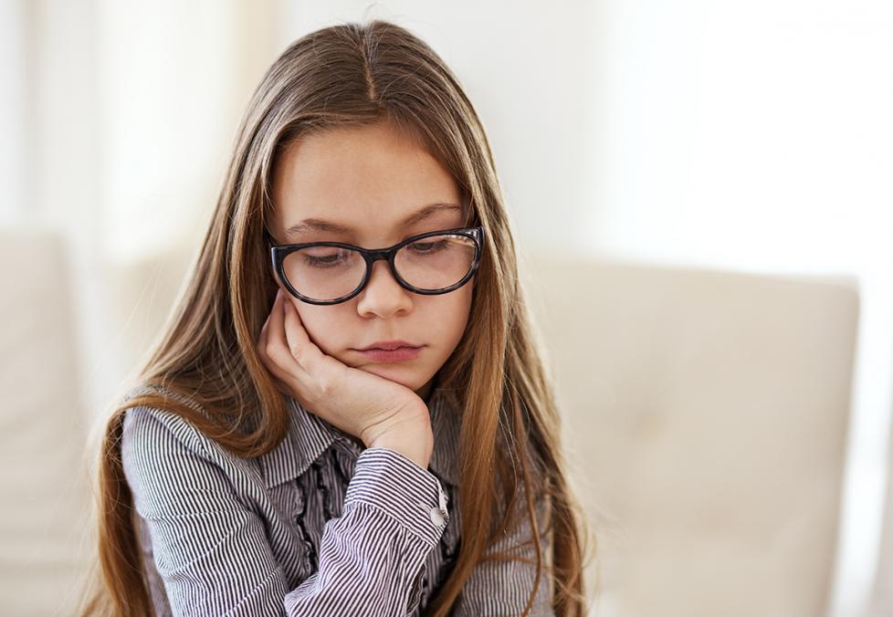 Depressed girl with glasses