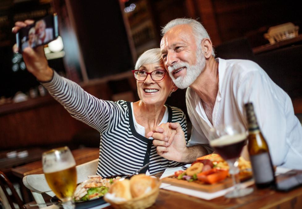 older couple taking a selfie