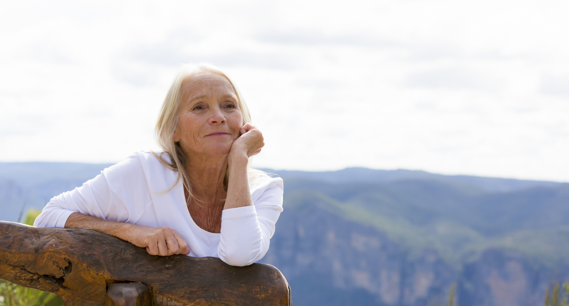 Older woman looking at mountain view
