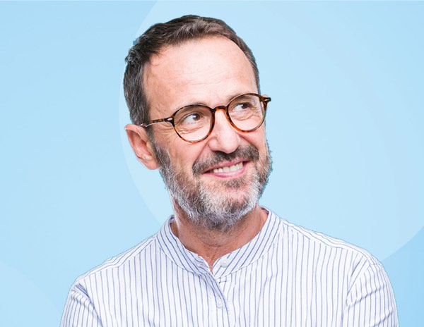 man wearing glasses blue background